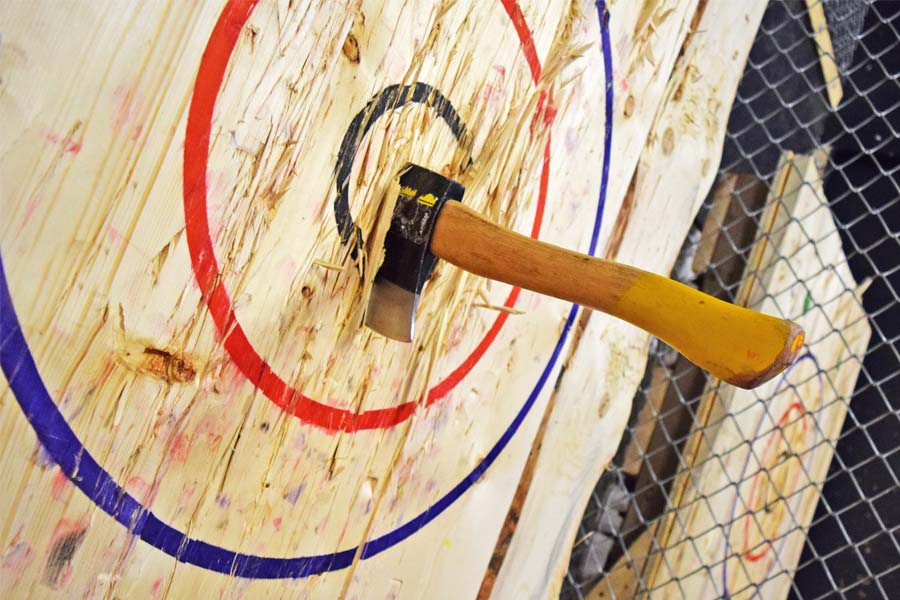 An Axe buried in a target after being thrown